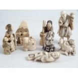 A COLLECTION OF EIGHT JAPANESE IVORY NETSUKE, all pre 1900. Lion Dog signed. One restored.