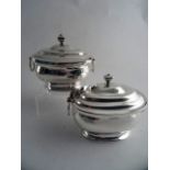 A PAIR OF GEORGE III SILVER SUGAR BOXES AND COVERS, London 1808 and 1807, Thomas Wallis. Stepped and