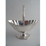 A GEORGE III SILVER SUGAR BASKET, London 1793, Solomon Houghman. Bright cut engraved border below