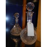 A crystal port decanter and a ships deca