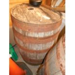 A large coopered oak metal bound barrel