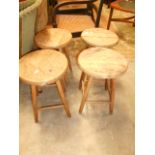 A set of four antique beech stools