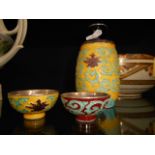 An oriental decanter and two small bowls