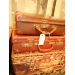 Two small vintage leather suitcase and a
