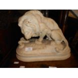 A 19th c plaster figure of a lion fighti