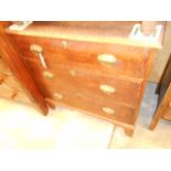 A Georgian oak chest of three graduated