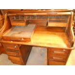 An 1930's American oak roll-top desk, th