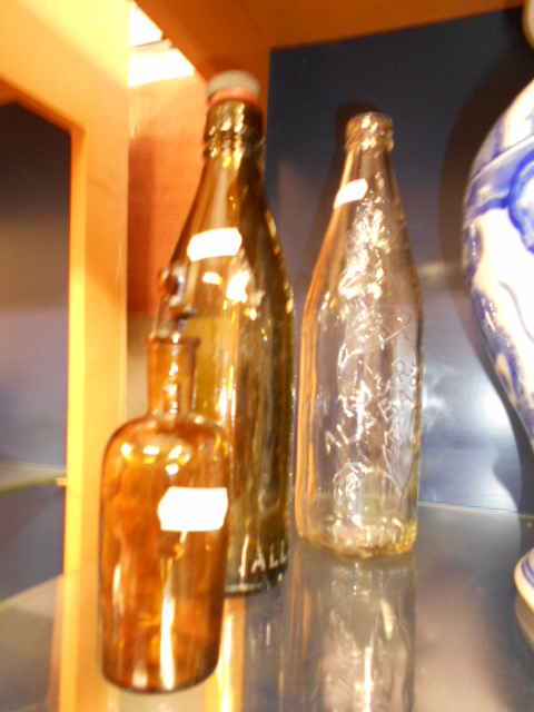 Three vintage glass bottles