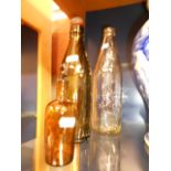 Three vintage glass bottles