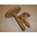 Three wooden darning mushrooms