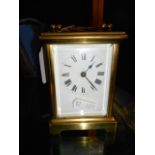 A mid 20th C French brass carriage clock