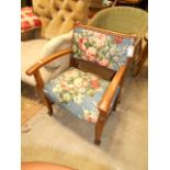 An oak bedroom chair having tapestry uph