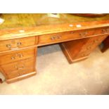 A Victorian oak pedestal desk with toole