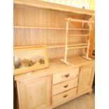 A vintage pine dresser the top having tw