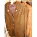 A men's vintage tan leather jacket and a