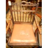 A Country oak open elbow chair having sp