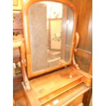 A Victorian walnut framed swing framed dressing mirror