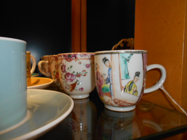 A group of five 19th C Oriental tea cups with floral and portrait decoration
