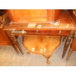 A Victorian mahogany washstand with 3/4 shaped gallery above three frieze drawers and raised on