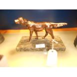 A late 20th C bronzed figure of a pointer on a marble base