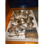 A mixed selection of silver items to include cruet, cream jug, pair of articulated swans,