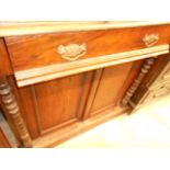 An Edwardian walnut mirrored back chiffonier