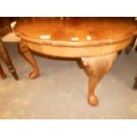 A burr walnut quarter veneered pie crust top occasional table raised in shell carved cabriole