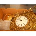 An ornate French embossed brass wall clock having enamel dial