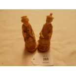 A pair of Chinese carved ivory figures 'Male and Female' in seated position A/F