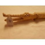 A late 19th C African heavily carved ivory crocodile,