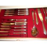 A white-painted four drawer canteen of silver plated cutlery