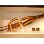 A selection of vintage sports equipment to include putters, fishing rod,