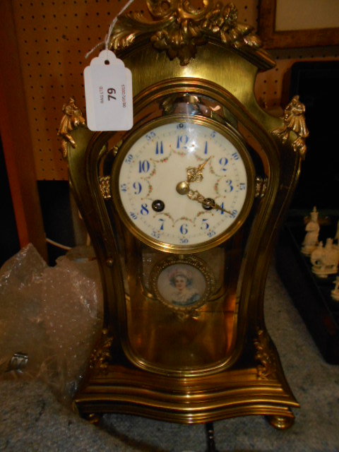 A Samuel Marti of Paris brass and glass mantle clock,