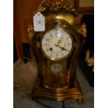 A Samuel Marti of Paris brass and glass mantle clock,