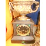 A Howells and James slate mantle clock having black dial with gilt Roman numerals,