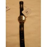 A gent's 14K gold Omega 'Playboy' wristwatch with black leather straps