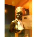 A carved stone and granite African female bust signed 'J.