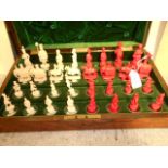 A 19th C carved and stained Anglo-Indian chess set,