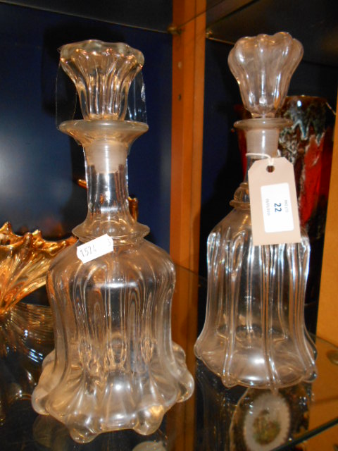 A pair of fluted glass decanters of waisted form