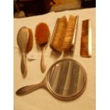 A Birmingham 1914 silver backed grooming set with hand mirror by Mappin & Webb with engine turned