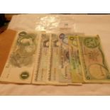 Two Bank of England £5 notes and a Bank of Scotland £5,