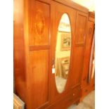 An Edwardian inlaid and chequered strung mahogany mirrored door wardrobe