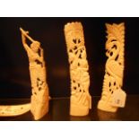 Three carved bone mantle decorations depicting a horseman,