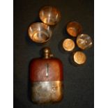 A silver plated and leather covered hip flask,