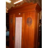 A late 19th/early 20th C Art Nouveau walnut single wardrobe,