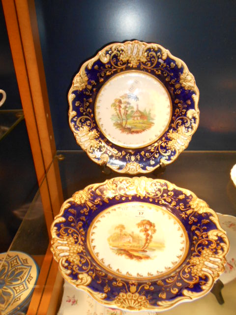 A pair of 1830 Spode cobalt blue and gilt bordered plates with pictorial landscape panels