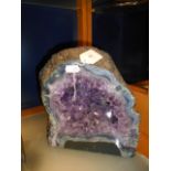 A large geoide of amethyst crystals