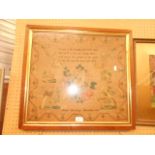 A Victorian framed sampler with flowers,