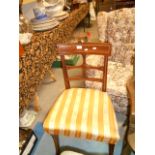 An Edwardian walnut inlaid side chair with cross shape splat with brass star inlay over a padded