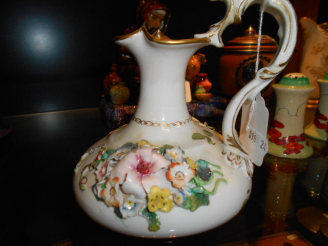 A Victorian Derby floral encrusted ewer with scrolled handle and gilt banding (A/F)